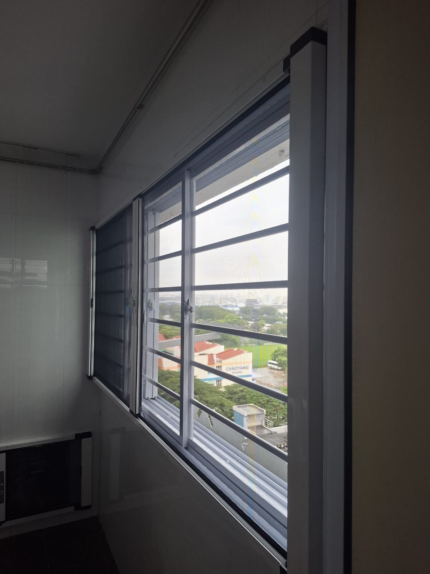 Side view of a BlindXpert BX MultiPro Screen installed with an existing window grille