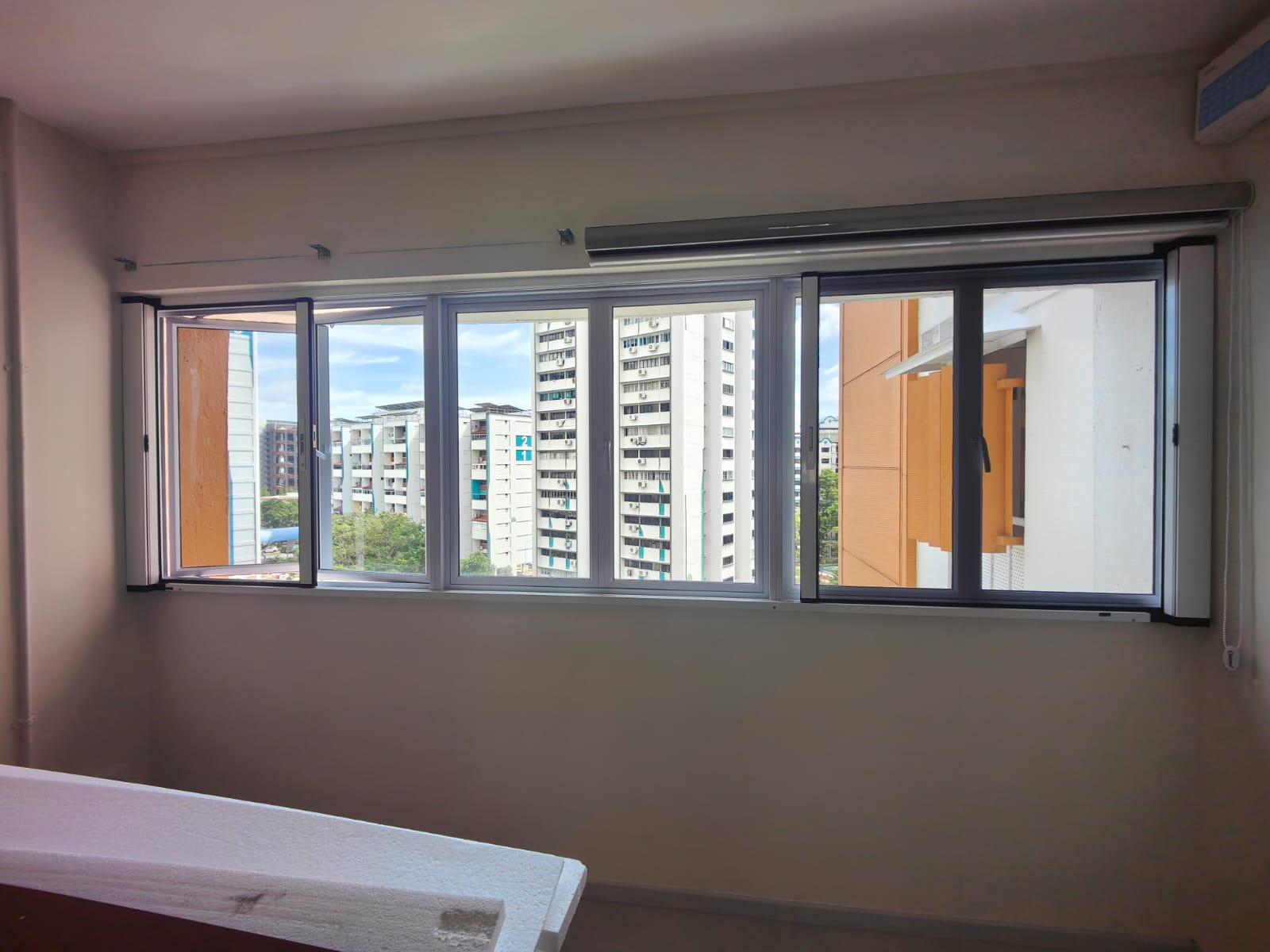 Wide BlindXpert BX MultiPro Screen installation across multiple HDB window sections
