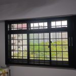 BlindXpert BX MultiPro Screen installed on a Singapore window with existing grilles