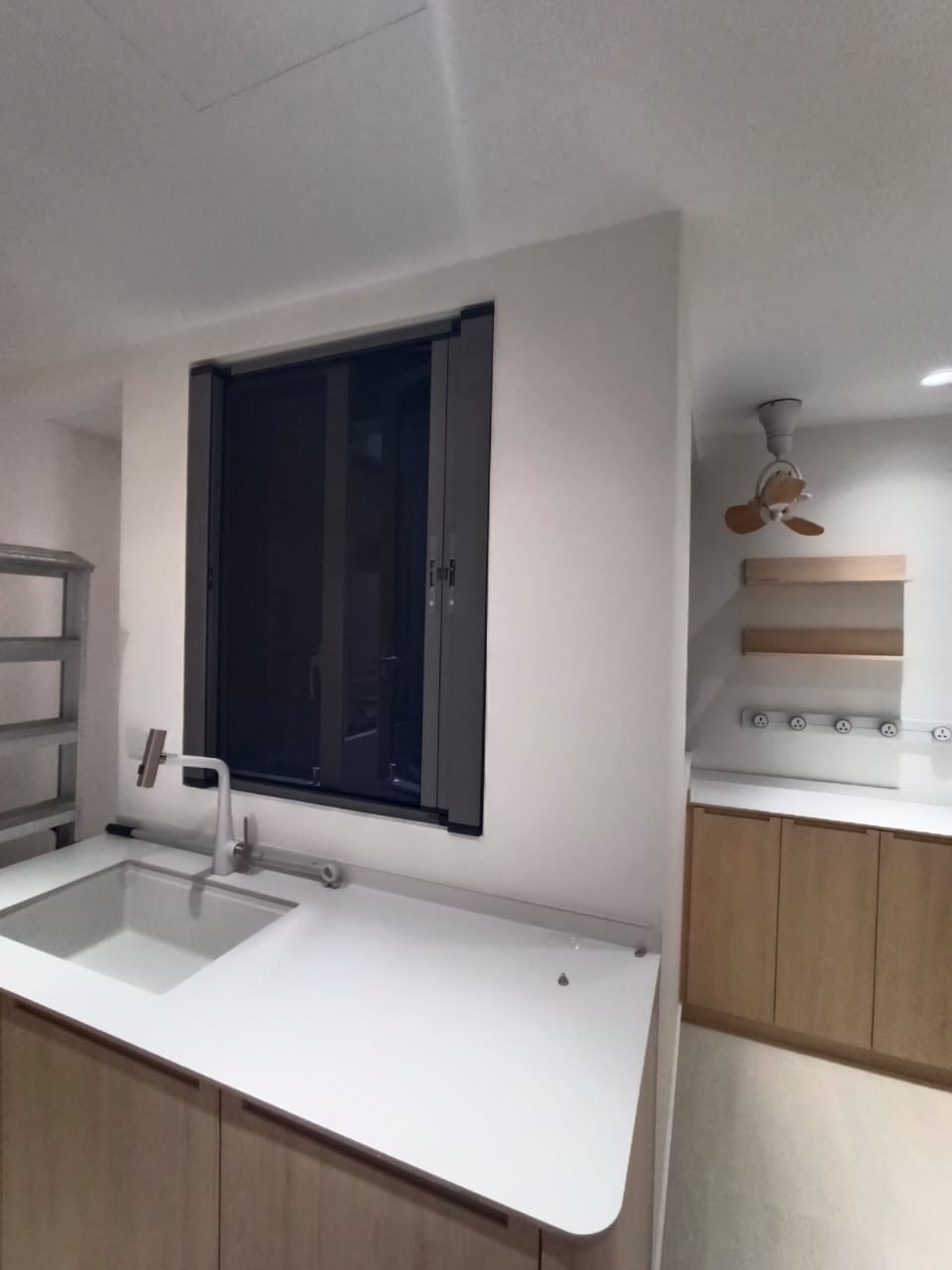 BlindXpert 2-in-1 window system with insect screen in use and blind retracted
