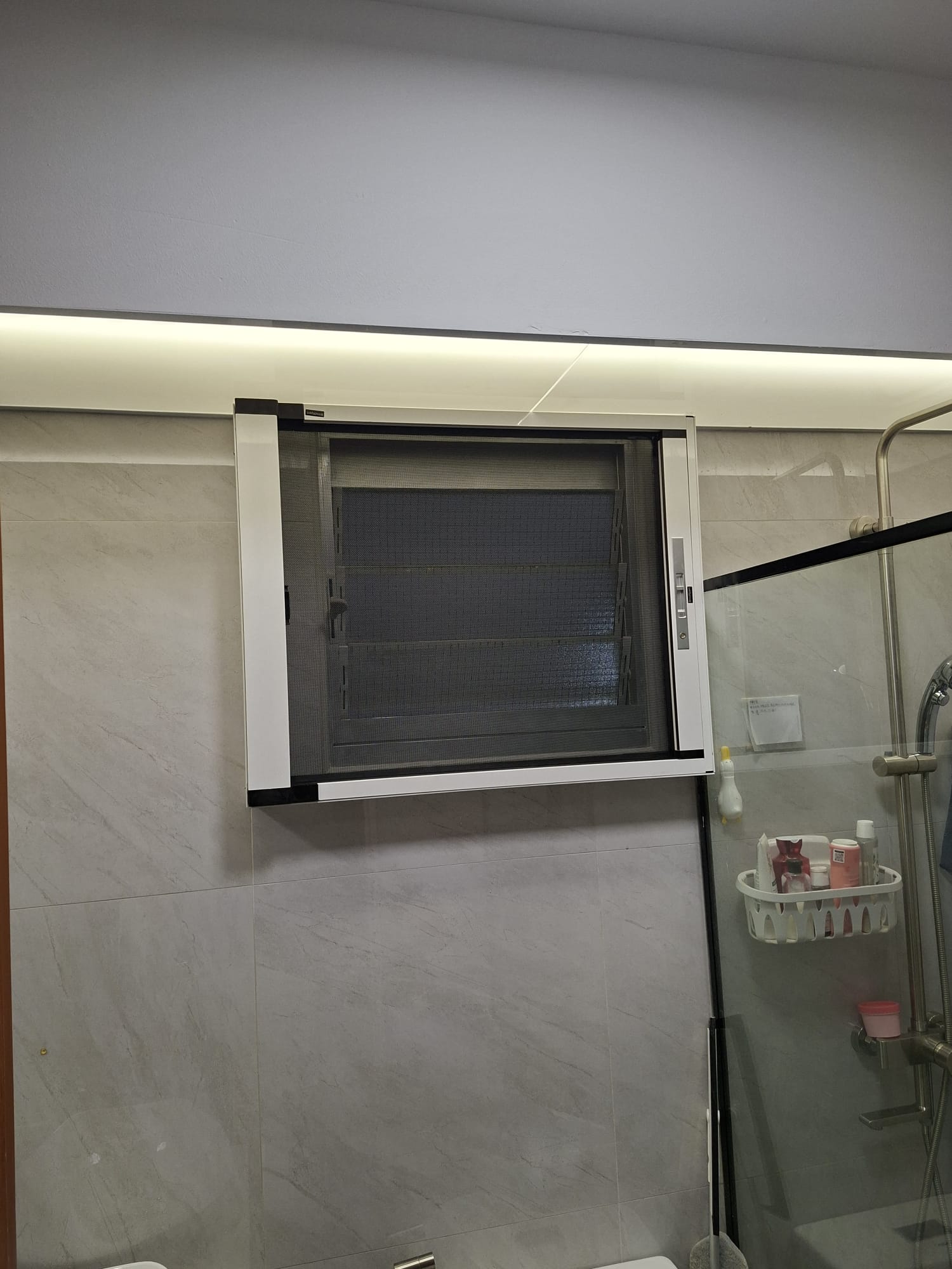 BlindXpert insect screen fitted around an existing window handle and grille