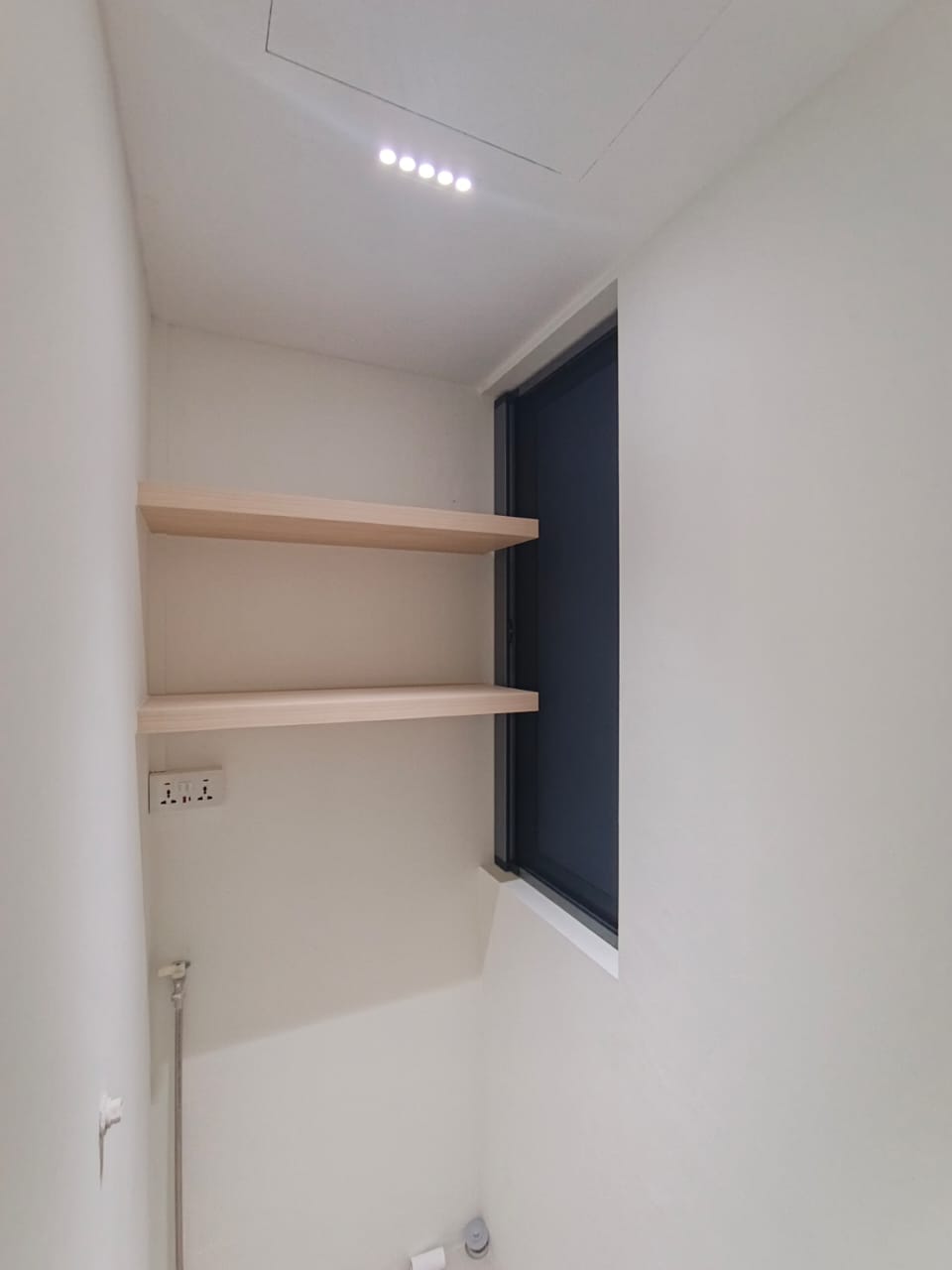Single-layer BlindXpert sunshade installed on a compact window