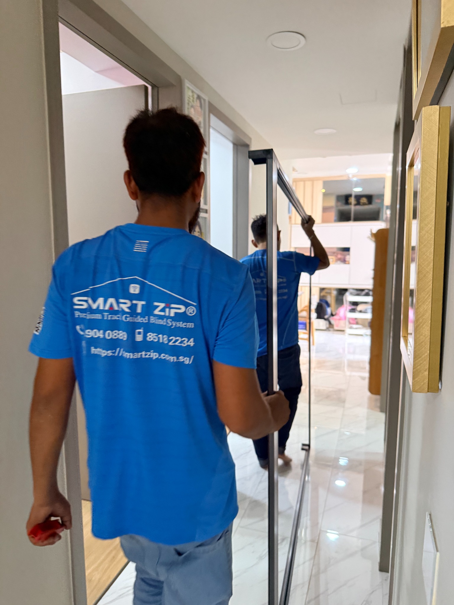 BlindXpert team measuring a residential window before installation