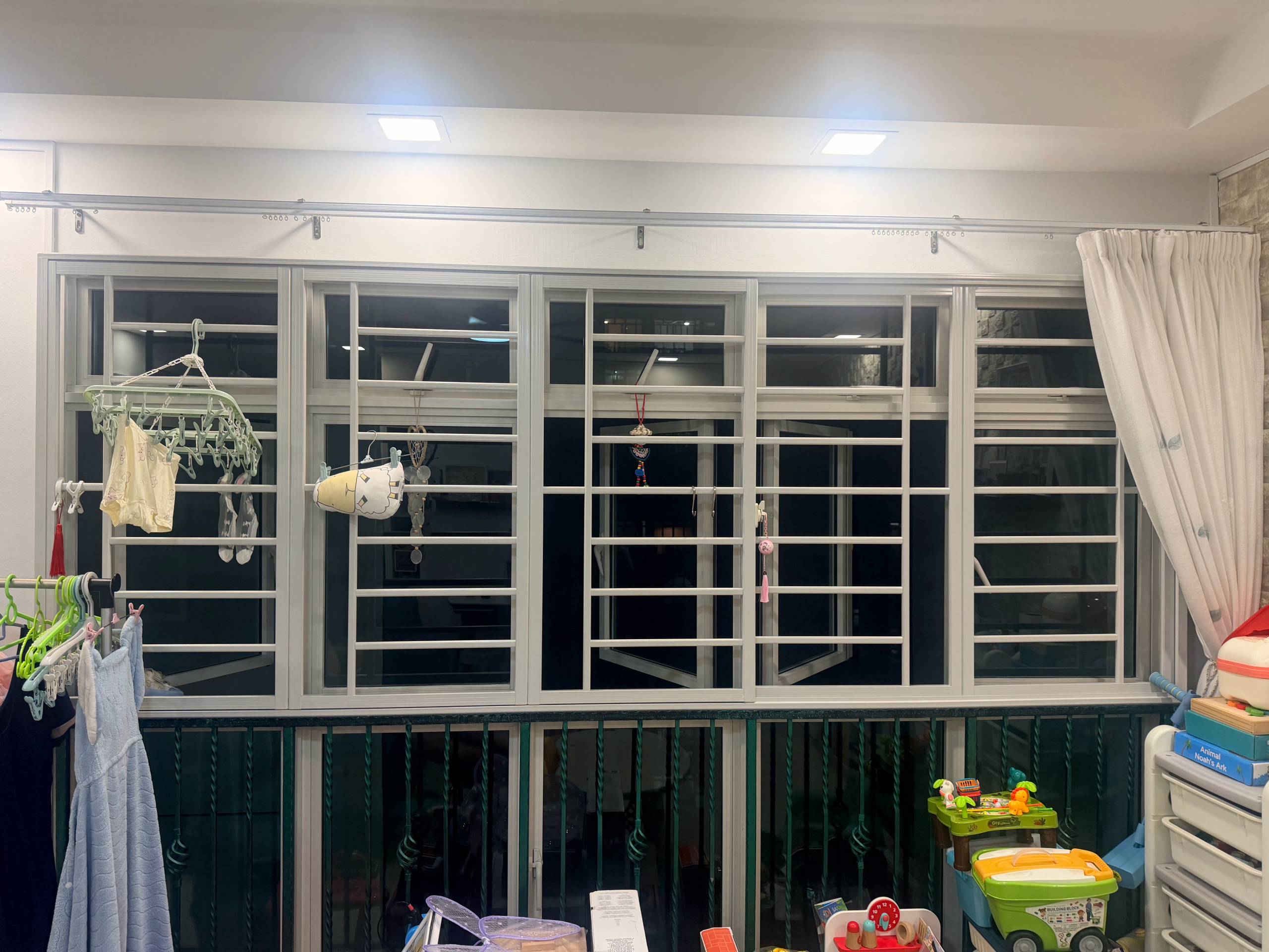 Existing casement windows with grilles photographed before an insect screen installation assessment