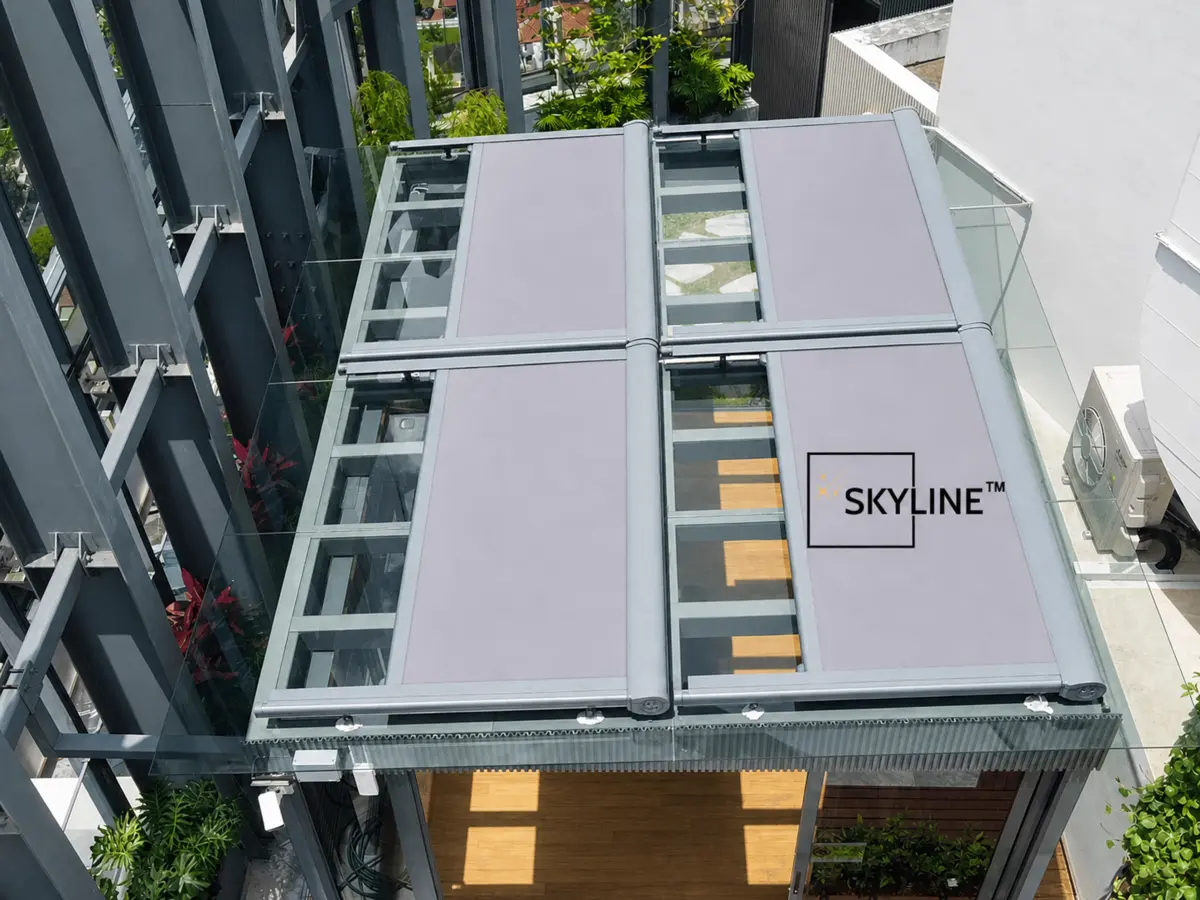 Retractable roof shades installed over an outdoor living area